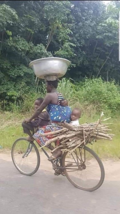 Multi tasking woman on bike